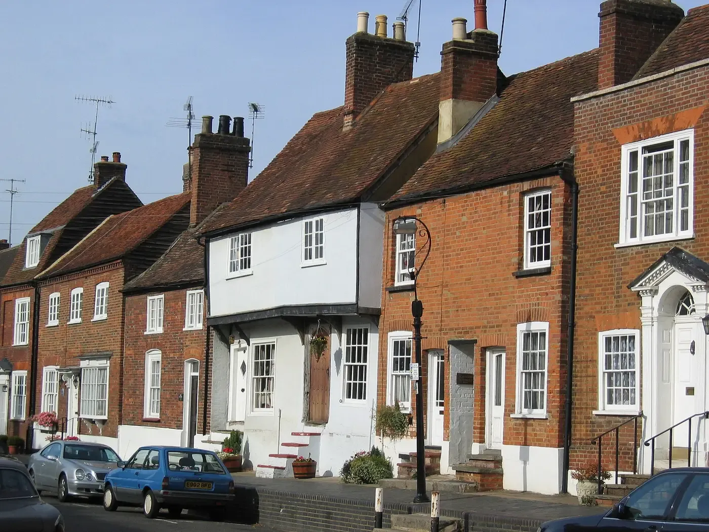 A row of period brick houses with timber sash windows on Fishpool Street, St Albans