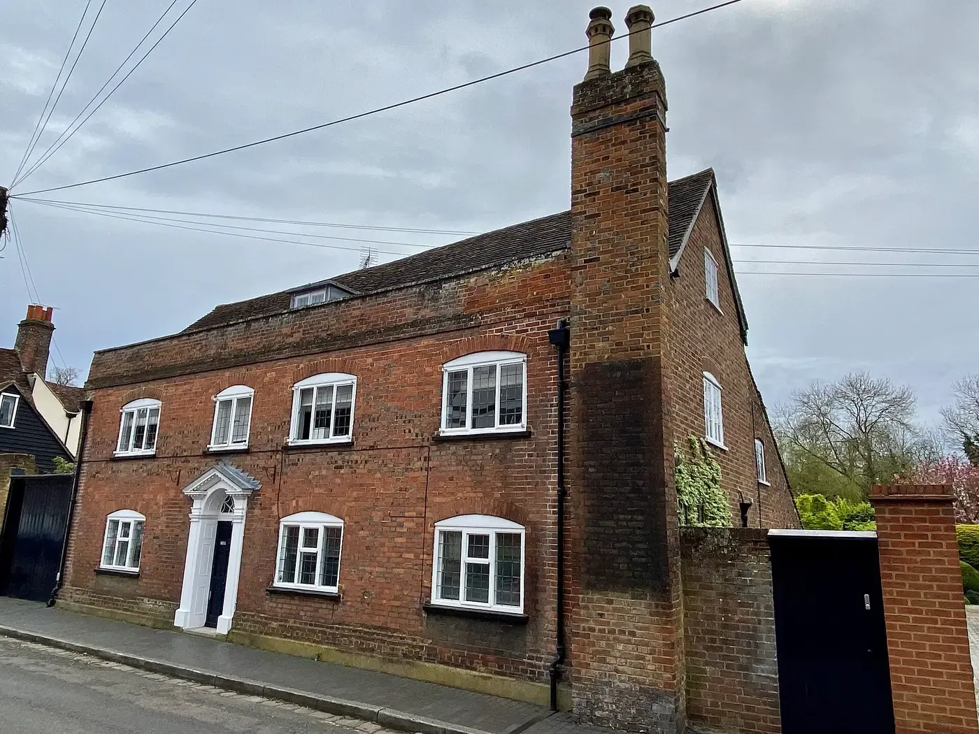 A Georgian brick house on Fishpool Street, St Albans, with white-painted sash windows