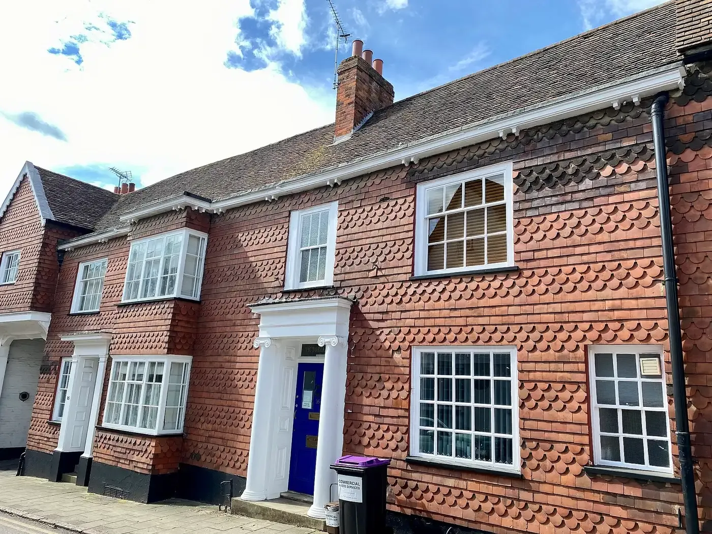 A mathematical-tile front on Tilehouse Street, Hitchin, with white-painted sash windows